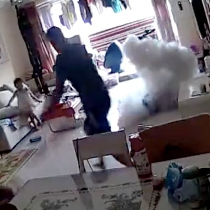 Smoke bursts from the electric scooter after it suddenly exploded inside a home in Beijing while charging. Photo: weibo