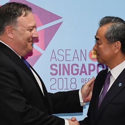 US Secretary of State Mike Pompeo and China's Foreign Minister Wang Yi shake hands before their bilateral meeting at the 51st Association of Southeast Asian Nations in Singapore. Photo: Reuters