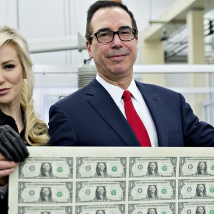 US Treasury Secretary Steven Mnuchin, an investment banker before joining the Trump administration, roused public criticism when he and his wife, Louise Linton posed with a sheet of uncut dollar notes in November 2017, with observers comparing them to “Bond villains”. Photo: Bloomberg