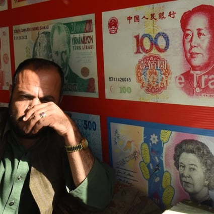 A currency dealer in Quetta, Pakistan. Photo: AFP