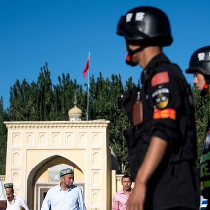 Police patrol the streets of Kashgar in China’s Xinjiang Autonomous Region. Photo: AFP