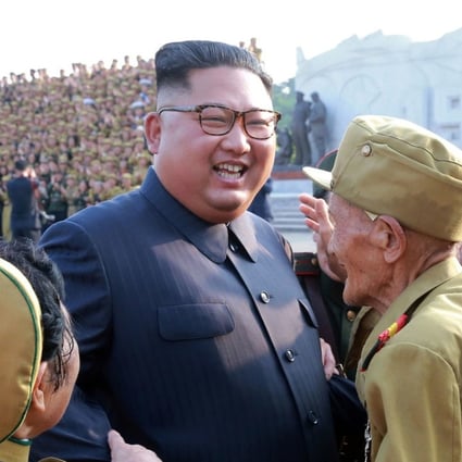 In this July 26, 2018, photo, provided on July 27, by the North Korean government, North Korean leader Kim Jong Un, center, is greeted by the participants of a war veterans' meeting, on the 65th anniversary of the signing of the ceasefire armistice that ends the fighting in the Korean War, in Pyongyang. Independent journalists were not given access to cover the event depicted in this image distributed by the North Korean government. The content of this image is as provided and cannot be independently verified. Korean language watermark on image as provided by source reads: "KCNA" which is the abbreviation for Korean Central News Agency. (Korean Central News Agency/Korea News Service via AP)