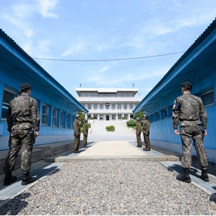 North Korean soldiers stand guard at the joint security area in the demilitarised zone in Panmunjom. China could take a greater role in peace talks. Photo: EPA-EFE