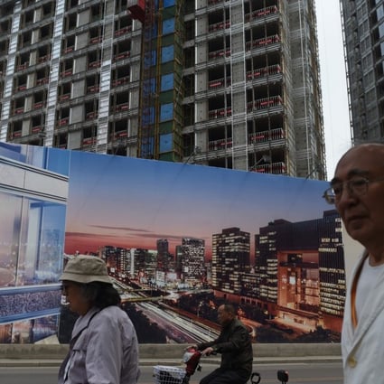 An advertisement for a new housing complex in Beijing. Chinese developers are facing rising complaints about safety and quality as they try to beat a business downturn by building properties as fast as they can. Photo: AFP