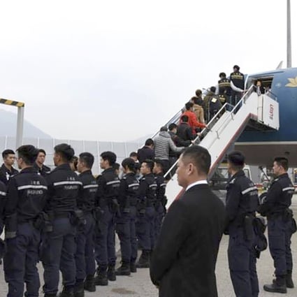 Hong Kong immigration authorities arranged a chartered flight to send 68 unsuccessful asylum seekers and illegal immigrants back to Vietnam. Photo: Hong Kong immigration authorities