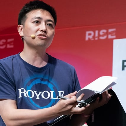 Bill Liu, co-founder, chairman and chief executive of Royole Corp, speaks during the Rise conference in Hong Kong in July. He said the firm is working on potential deals with smartphone manufacturers and carmakers. Photo: Bloomberg