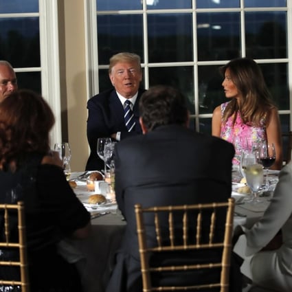 President Donald Trump entertained a group of 13 CEOs and senior White House staff at a dinner in the middle of his annual working vacation on Tuesday night. Photo: AP