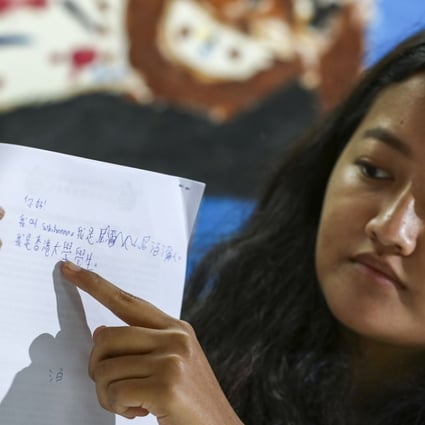 Suskihanna Gurung, 21, displaying her Chinese handwriting. Gurung will take part in a UN committee meeting addressing racial discrimination in Hong Kong. Photo: Nora Tam
