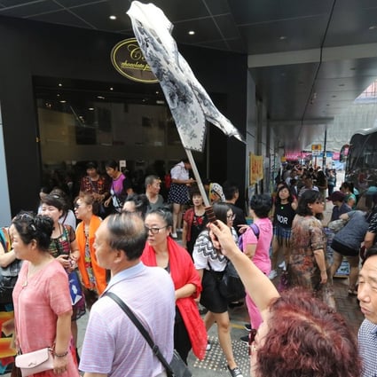 Mainland Chinese tourists at a shopping area in Tsim Sha Tsui on 26 September 2017. Visitors from China made up 76 per cent of the 58.5 million tourist arrivals in Hong Kong last year. Most came to shop for products and services that are unavailable in China, or which cost many times more. Photo: SCMP/ Felix Wong