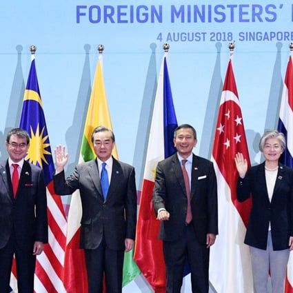 China’s Wang Yi (third from left) and other foreign ministers pose for a group photo during an Asean meeting on August 4 in Singapore. Photo: Xinhua