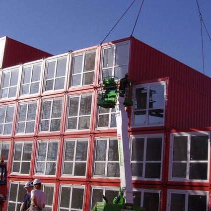 Prefabricated housing units being unloaded by crane in Amsterdam. Could they be part of the solution in Hong Kong? Photo: Tempohousing