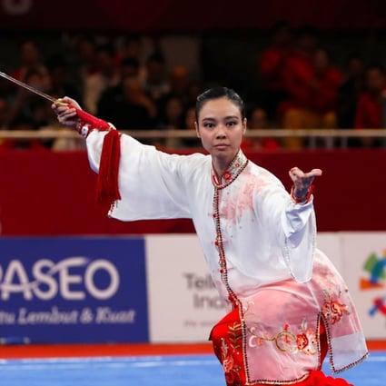 Indonesia’s Lindswell Kwok on her way to gold in wushu. Photo: Reuters