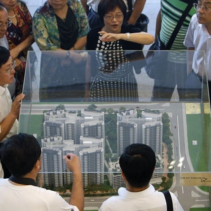 A model of a public housing estate at the Housing Development Board (HDB) gallery in Singapore. Photo: Reuters