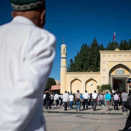 Muslim men arriving at the Id Kah Mosque for the morning prayer on Eid al-Fitr in the old town of Kashgar in China's Xinjiang Uygur Autonomous Region, in this 2017 file picture. Photo: AFP