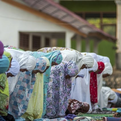 People affected by earthquakes attend a morning prayer marking Eid ul-Adha on Indonesia’s Lombok island. Photo: AP