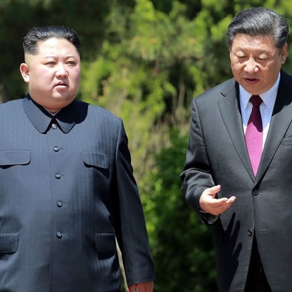 North Korean leader Kim Jong-un in a pinstripe buttoned-up suit and Chinese President Xi Jinping in a traditional Western suit-and-tie combination when the pair met in Beijing, China in May. Photo: AFP