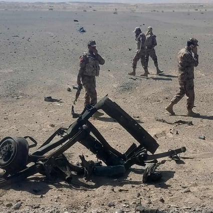 Pakistani security personnel inspect the site of a suicide attack that wounded at least five people, including two Chinese nationals. Photo: AFP