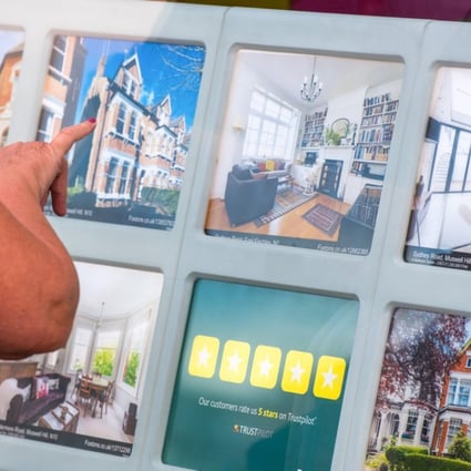 Residential property on display at an estate agent in London. Mortgage lending in the UK fell in July ahead of an interest rate rise by the Bank of England. Photo: Bloomberg