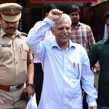 Indian poet and activist Varara Rao is escorted after his arrest in Hyderabad on Tuesday. Photo: AFP