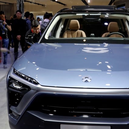 Car enthusiasts check out the NIO ES8 during a media preview of the Auto China 2018 motor show in Beijing on April 25, 2018. Photo: Reuters