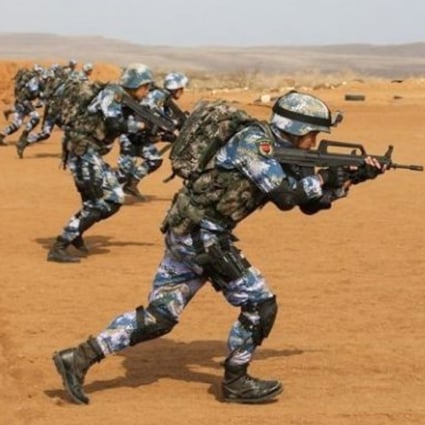Chinese troops based at China’s first overseas military base in Djibouti take part in a live-fire drill last year. The Afghan embassy said no Chinese military personnel would be stationed in Afghanistan. Photo: Handout