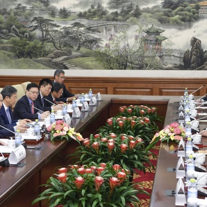 Chinese Vice Premier Liu He meets members of the international advisory committee of China Investment Corporation in Beijing on Tuesday. Photo: Xinhua