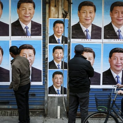 Posters of Chinese President Xi Jinping are plastered on a wall in Shanghai in March 2016. Photo: Chinatopix via AP