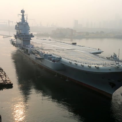 The 001A aircraft carrier leaving Dalian for its first sea trial in May. Photo: Reuters