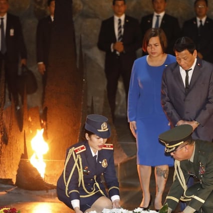 Philippine President Rodrigo Duterte, right, and his daughter Sarah lay a wreath at the hall of remembrance at the Yad Vashem Holocaust memorial museum in Jerusalem on Monday. Photo: EPA-EFE
