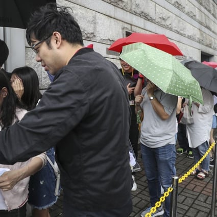 Nan Fung Development's LP6 project in Lohas Park attracted long queues of buyers at Octa Tower in Kowloon Bay, who braved a thunderstorm to snap up the units on offer on 8 September 2018. Photo: SCMP/Edward Wong.