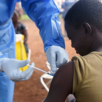 A Congolese health worker administers Ebola vaccine to a boy who had contact with an Ebola sufferer in the village of Mangina in North Kivu province of the Democratic Republic of Congo. Photo: Reuters/Olivia Acland