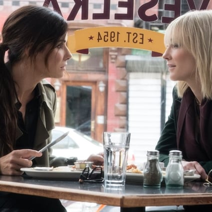 Sandra Bullock and Cate Blanchett in a scene from Ocean's 8, like Crazy Rich Asians a non-superhero Warner Bros. summer release.