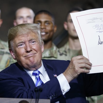 US President Donald Trump during a signing ceremony August 13 for the defence bill that expanded the powers of the inter-agency Committee on Foreign Investment in the United States. Photo: AP