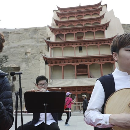 Musicians of the Gaudeamus Dunhuang Ensemble from Hong Kong rehearse before a performance in front of the Nine-Storey Pagoda at the Mogao Caves of music inspired by the ancient grottoes’ Buddhist art and artefacts. Photo: Simon Song