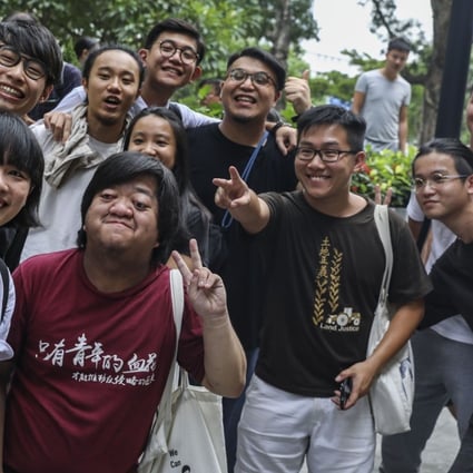Raphael Wong (second from right, front row) celebrates with others after the Court of Final Appeal overturned his and 12 other activists’ jail sentences for a 2014 protest. Photo: Sam Tsang