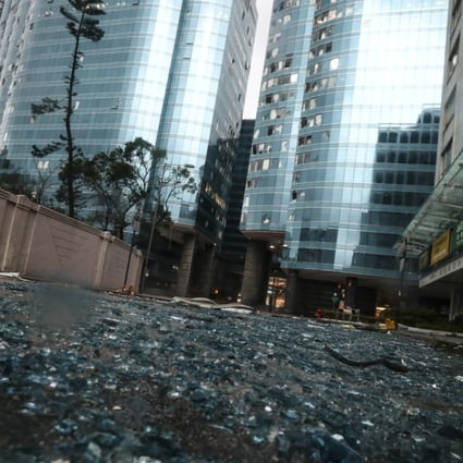 Broken windows and glass are seen strewn on the grounds surrounding Harbour Grand Kowloon in Whampoa, Hung Hom. Photo: Nora Tam