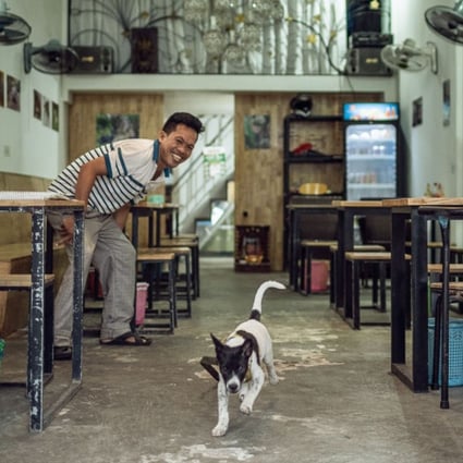 Chom Mong, who previously ran a dog meat restaurant but is now running a vegan restaurant, Sabay Vegilicious, in Phnom Penh, Cambodia. Photo: Enric Catala