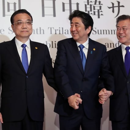 Chinese Premier Li Keqiang (left), Japanese Prime Minister Shinzo Abe (centre) and South Korean President Moon Jae-in held a summit in May, but a free-trade agreement has yet to materialise. Photo: EPA-EFE