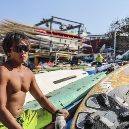 Ho Chi-ho, owner of Hiwindlover Water Sports Center, surveying the damage in Stanley on Hong Kong Island after Typhoon Mangkhut hit the city. Photo: Winson Wong