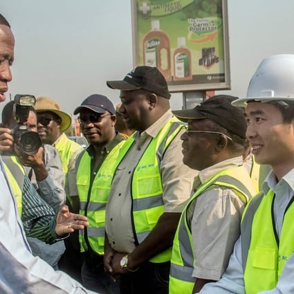 Zambian President Edgar Lungu (left) greets Chinese workers from Aviation Industry Corporation of China in Lusaka earlier this month. Photo: AFP