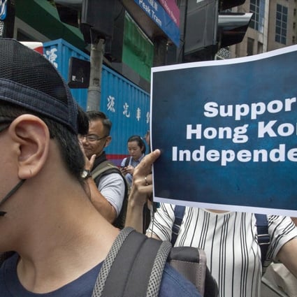 Pro-independence supporters gather near the Hong Kong Foreign Correspondents’ Club on August 14 in support of National Party leader Andy Chan, who gave a speech at the venue. Photo: EPA