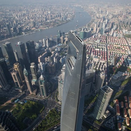 A general view from Shanghai Tower Observation Deck showing Shanghai World Financial Center. Photo: EPA