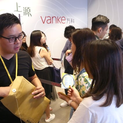 Prospective investors queue up for Vanke Property (Hong Kong)’s Le Pont project in Tuen Mun, where 347 flats were on sale, on Sunday. Photo: Edmond So