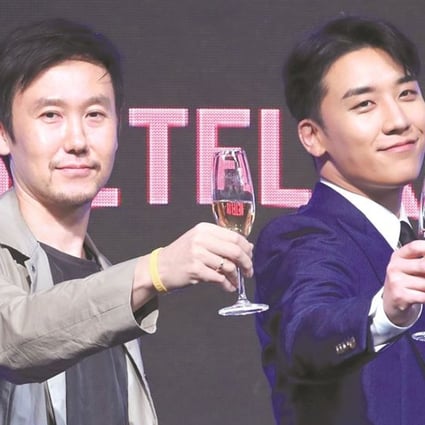 Seungri (right), a member of YG Entertainment’s boy band Big Bang, and Park Jun-su, a producer on the sitcom ‘YG Future Strategy Office’, attend an event to publicise the new show in Seoul on Monday. Photo: Yonhap