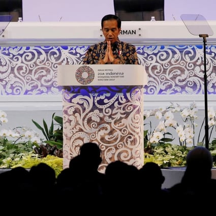 Indonesia President Joko Widodo gestures during a speech at a plenary session at International Monetary Fund – World Bank Annual Meeting 2018 in Nusa Dua, Bali, Indonesia on Friday. Photo: Reuters
