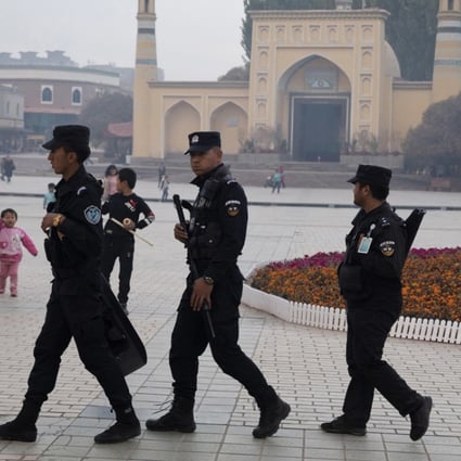 China’s Xinjiang region has revised a local law to allow local governments to “educate and transform” people influenced by extremism. Photo: AP
