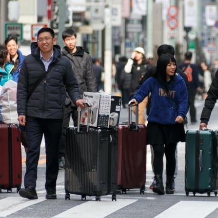 Tourists in the Ginza shopping area of Japan. Photo: AFP