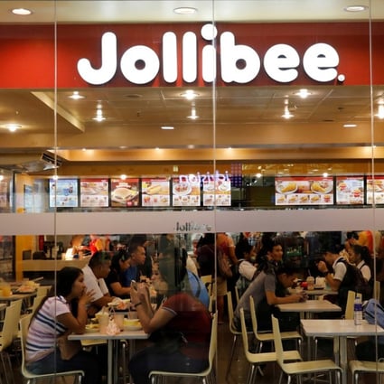 Customers eat at a Jollibee outlet in Quezon City. Photo: Reuters