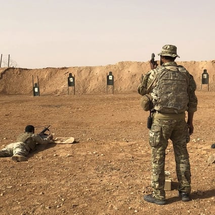 Members of the Maghawir al-Thawra Syrian opposition group receive firearms training from US Army Special Forces soldiers. Photo: AP