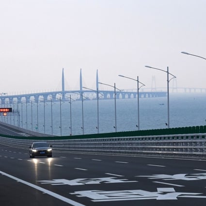 A car drives on the Hong Kong-Zhuhai-Macau Bridge. Photo: Xinhua